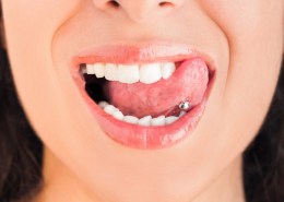 Pierced tongue licking lips